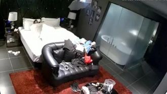 A couple was photographed having sex in a black leather sofa room