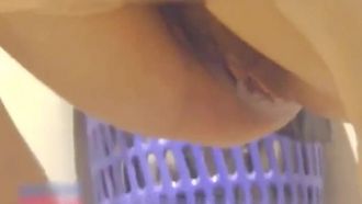 A weirdo's handheld device in a public restroom was used to record a staff member showing his face and peeing on a young woman in black stockings and her beautiful pussy