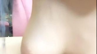 The girl with big breasts and glasses shows off naked and touches her breasts on the bed, which is very attractive