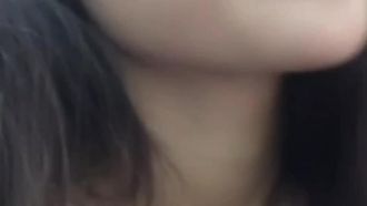 The girl with big breasts and big eyes keeps showing off her pink pussy while listening to music