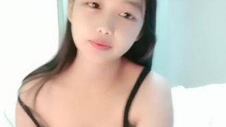A young woman with childlike face and big breasts has just given birth and is still breastfeeding. She moans during various thrusts. She has a lot of milk and uses props to masturbate her pussy.