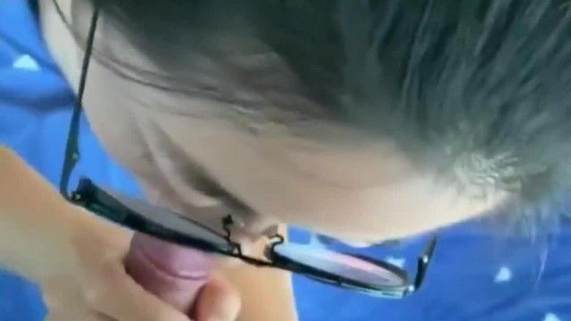 My ladylike girlfriend with glasses looked at me with an innocent look on her face while recording the short video. She lovingly lowered her head to take my dick in her mouth.